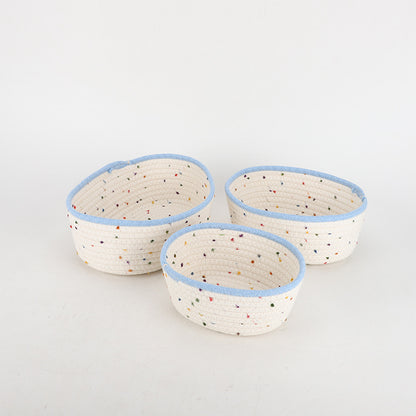 Storage basket made of natural cotton fabric with colorful dots