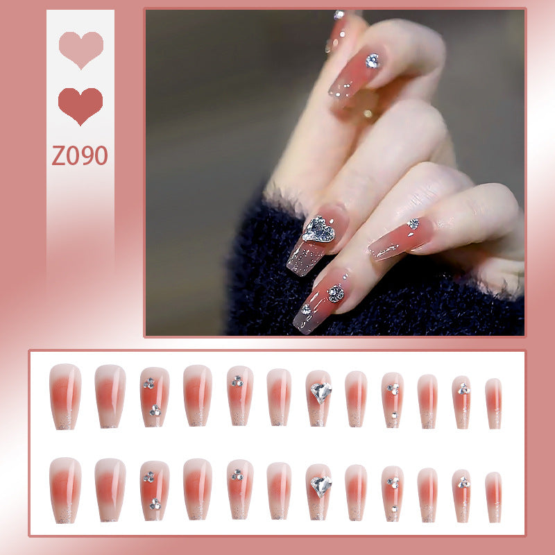 Acrylic nail set with elegant heart and rhinestone decorations Acalora
