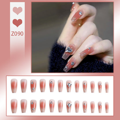 Acrylic nail set with elegant heart and rhinestone decorations Acalora