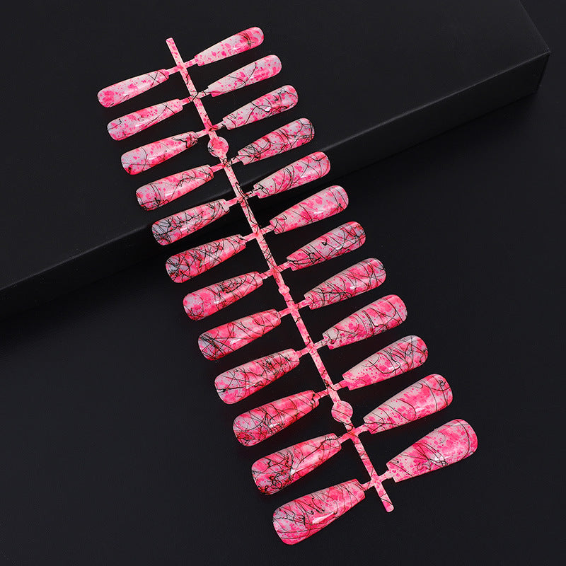 Creative nail art with blood splatter design Acalora