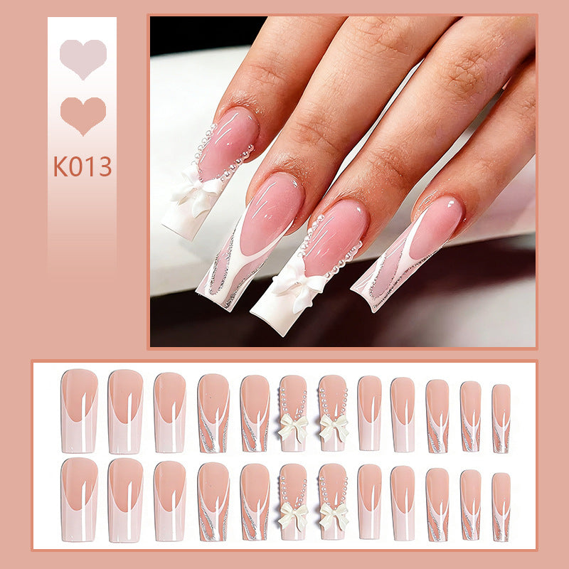 Artificial nail set with elegant bow and pearl decorations Acalora