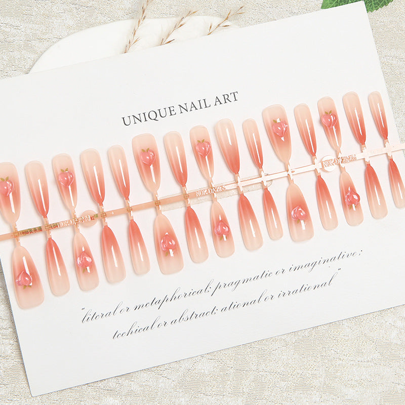 Nail set in elegant ombre design with artistic accents Acalora