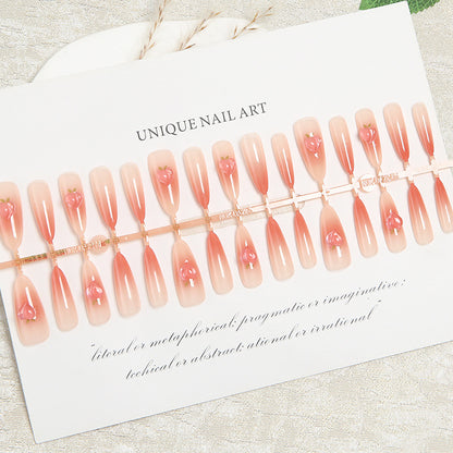 Nail set in elegant ombre design with artistic accents Acalora