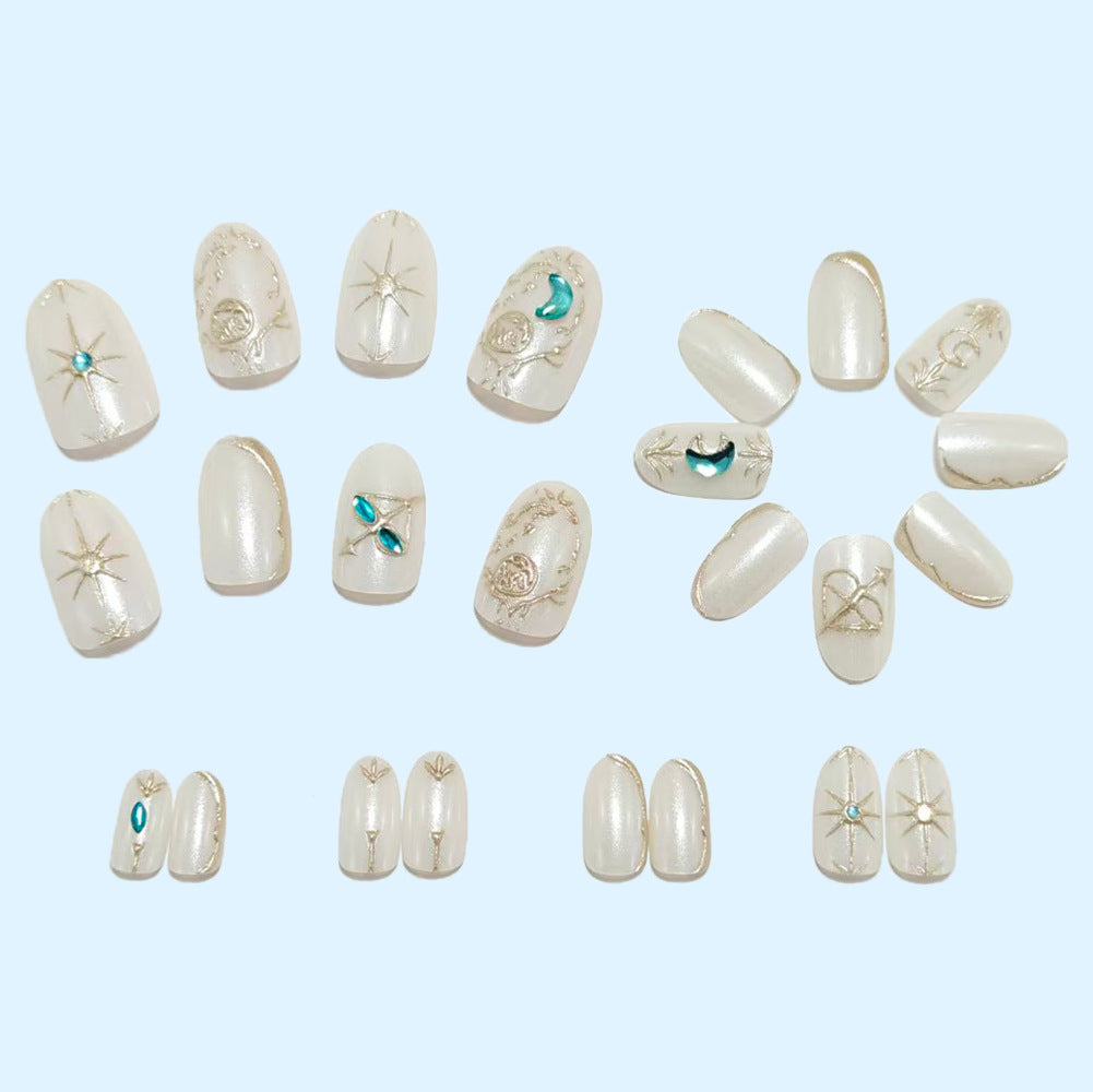 Artificial nails with elegant jewelry embellishments Acalora