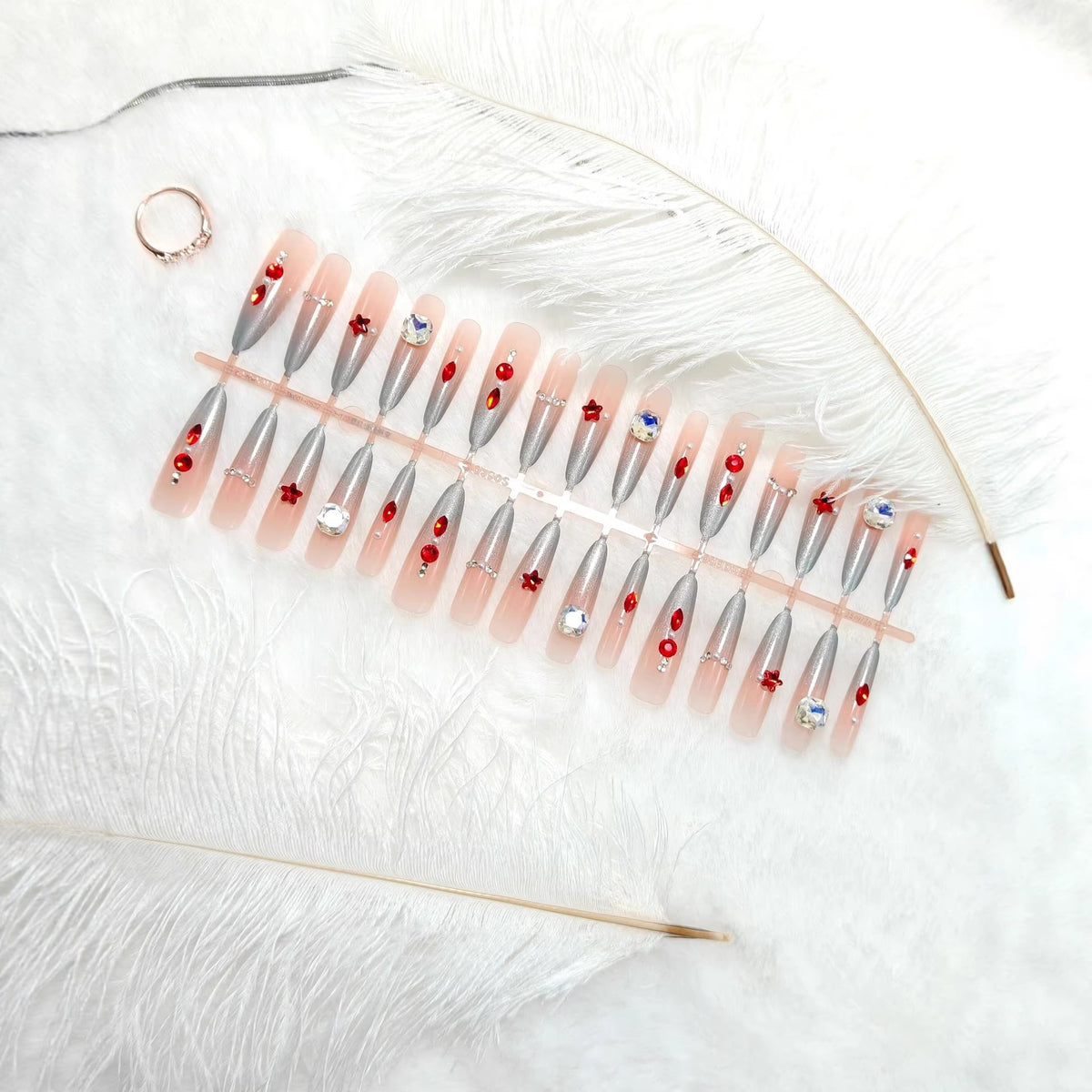 Artificial nails with glamorous glitter design and 3D applications Acalora