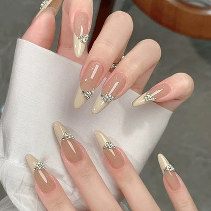 Acrylic nail set with elegant tips and sparkling appliqués Acalora