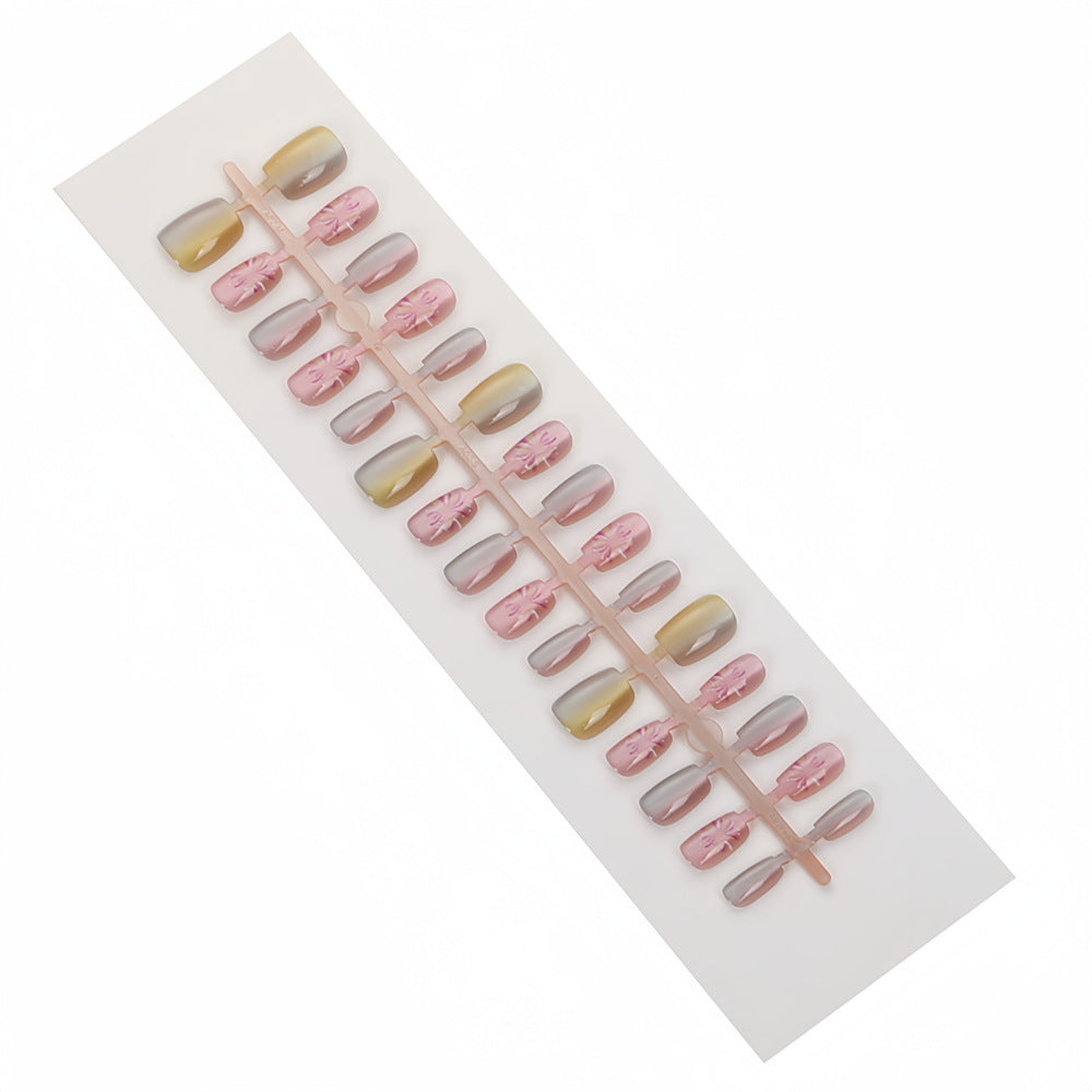 Artificial nails in modern ombre design with floral accents Acalora