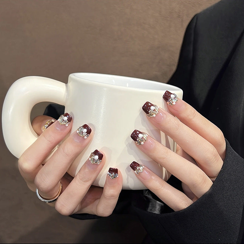 Acrylic nail set with elegant glitter and flower accents Acalora