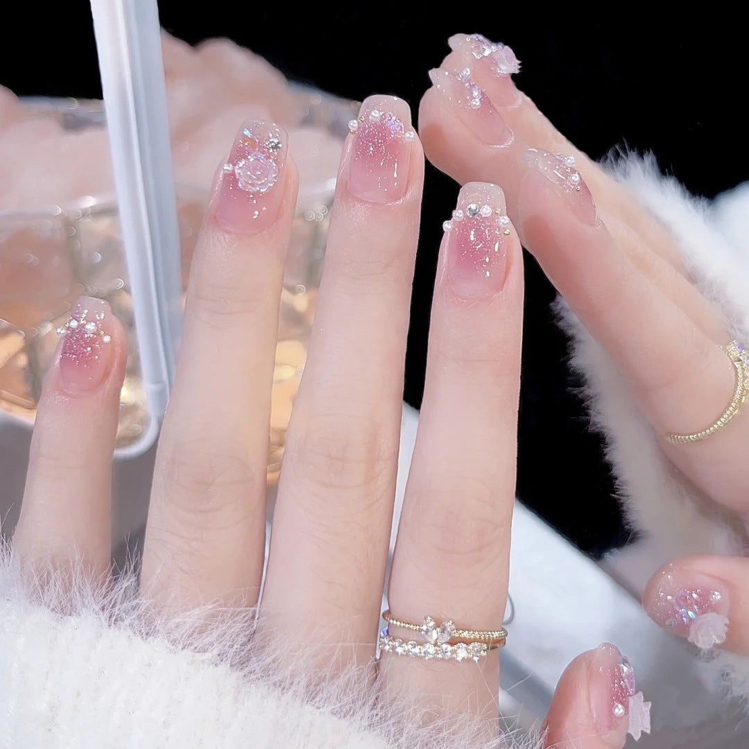 Artificial nail set with sparkling glitter and pearl decorations Acalora
