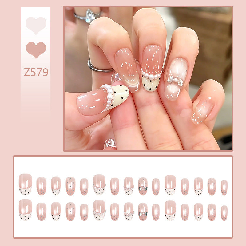 Artificial nail set with elegant French design and delicate pearl embellishments Acalora