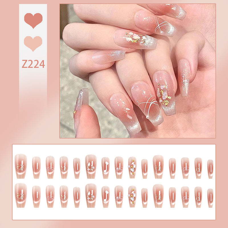 Artificial nail set with elegant glitter and flower decorations Acalora