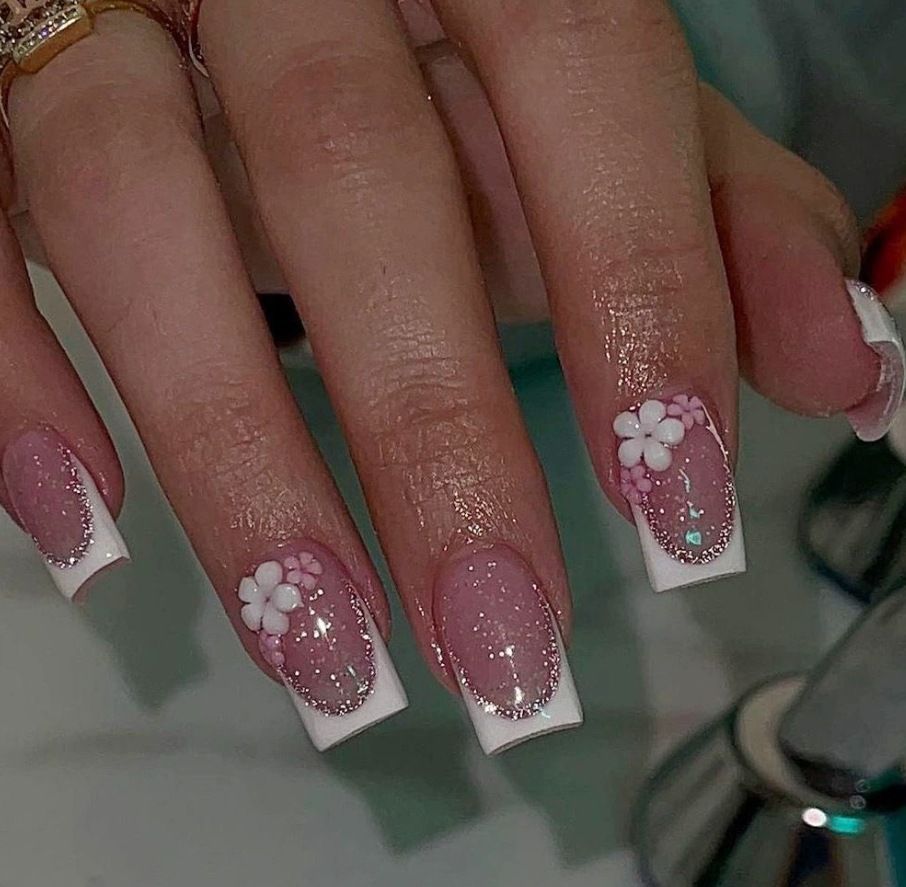 Acrylic nail set with elegant French tip and delicate floral decorations Acalora