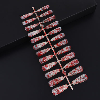 Creative nail art with blood splatter design Acalora