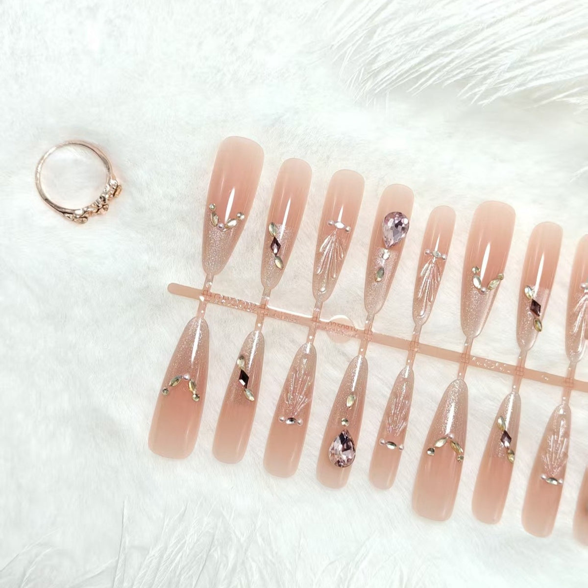 Artificial nails with glamorous crystal embellishments Acalora