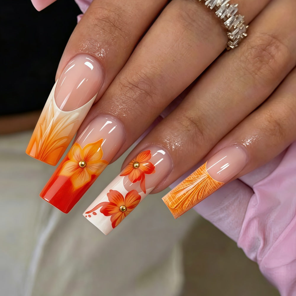 Nail art with floral accents and glitter Acalora