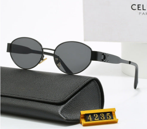 Women's elegant oval sunglasses with gold-colored frame Skanto
