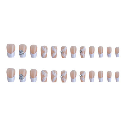 Elegant artificial nail set with delicate decorations and glitter elements Acalora