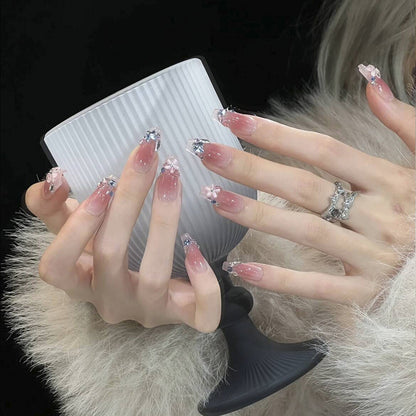 Artificial nail set with glamorous 3D decorations and shimmering accents Acalora