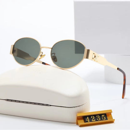 Women's elegant oval sunglasses with gold-colored frame Skanto