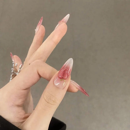 Nail set in elegant ombre design with artistic accents Acalora