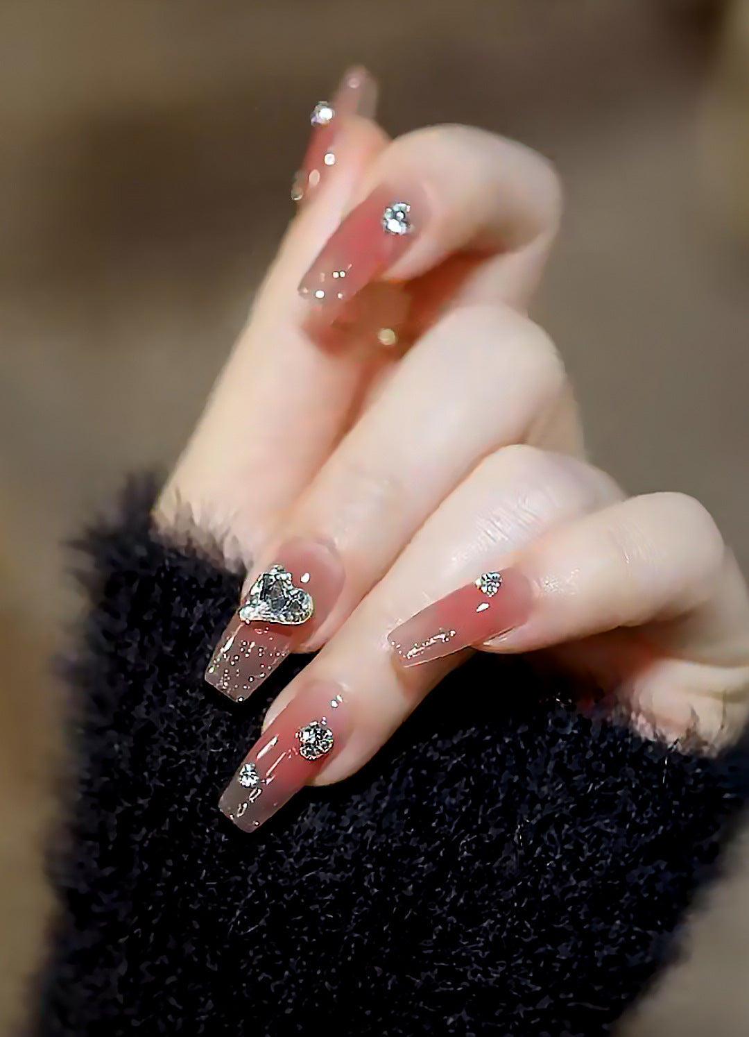 Acrylic nail set with elegant heart and rhinestone decorations Acalora