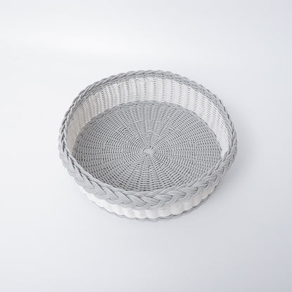 Handwoven storage basket with decorative edge