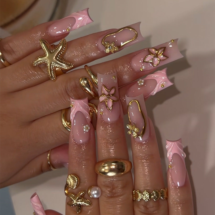 Acrylic nail set with glamorous golden accents Acalora