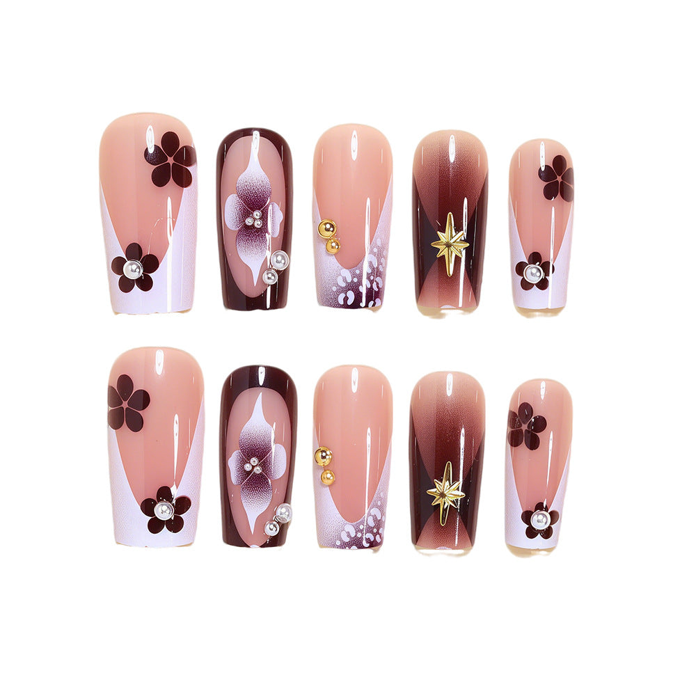 Artistic Acrylic Nail Design Set with Floral and Gold Accents Acalora