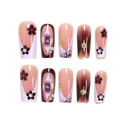 Artistic Acrylic Nail Design Set with Floral and Gold Accents Acalora