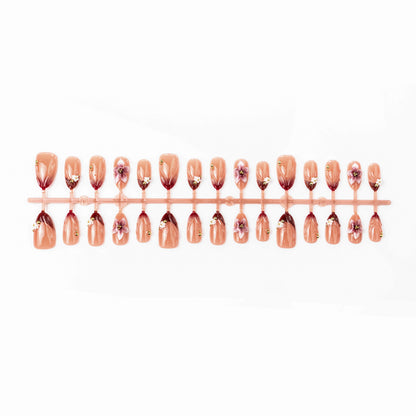 Artificial nail set with floral accents and gold embellishments Acalora