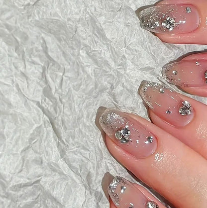 Acrylic nail set with extravagant glitter and crystal embellishments Acalora