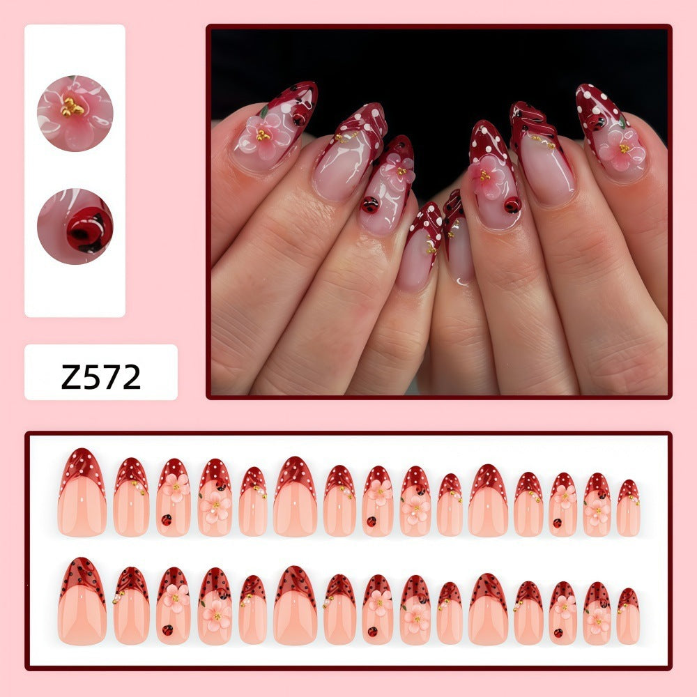 Creative tip design artificial nails with floral accents Acalora