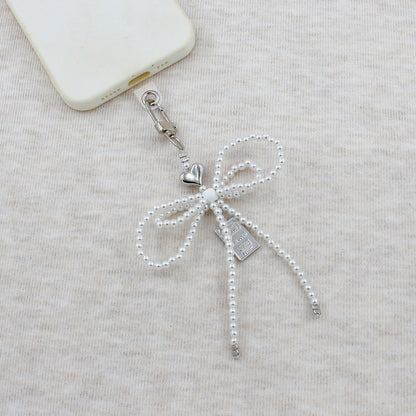 Elegant Beaded Bow Brooch Acalora