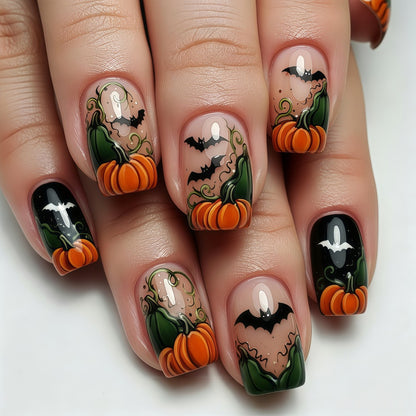Artificial nails in Halloween design with pumpkins and ghosts Acalora