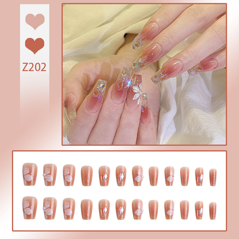 Artificial nail set with floral and glittering accents Acalora