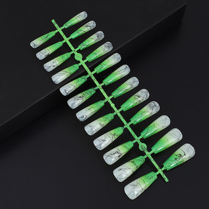 Artificial nails in modern ombre design with marbled accents Acalora