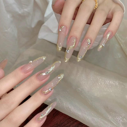 Artificial nail set with elegant gold design and sparkling applications Acalora