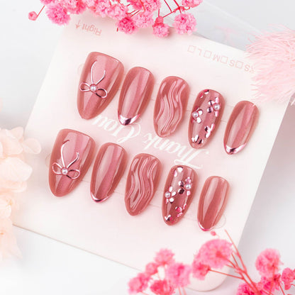 Nail art set with elegant bows and pearl accents Acalora
