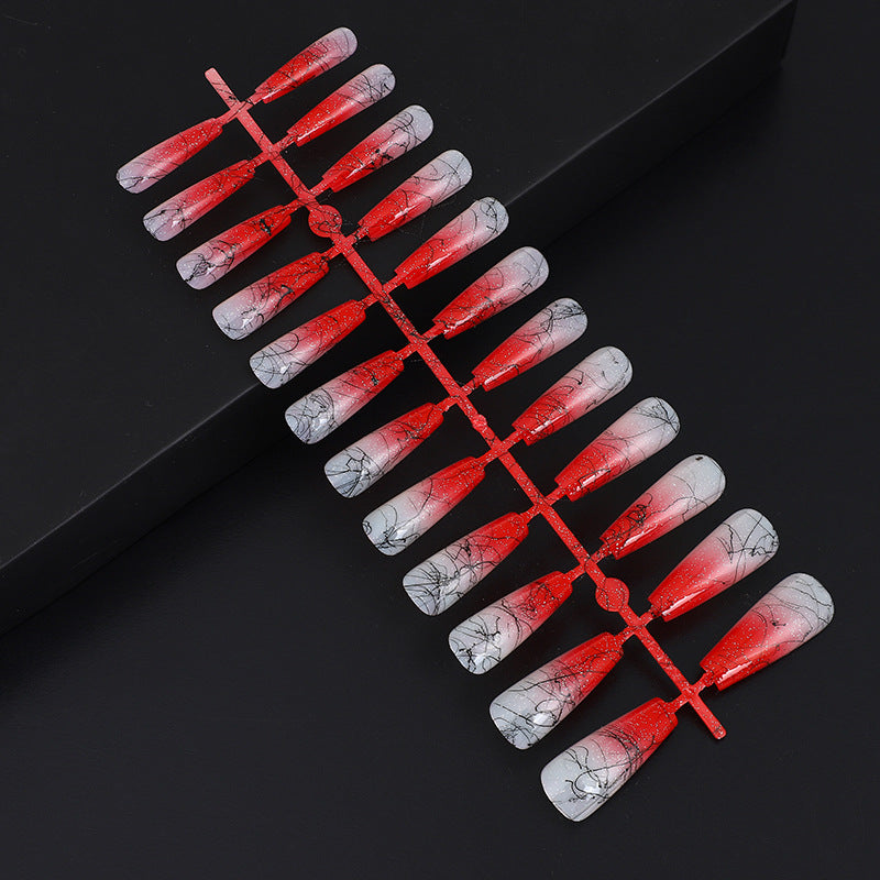 Artificial nails in modern ombre design with marbled accents Acalora