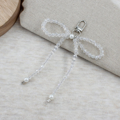 Elegant Beaded Bow Brooch Acalora
