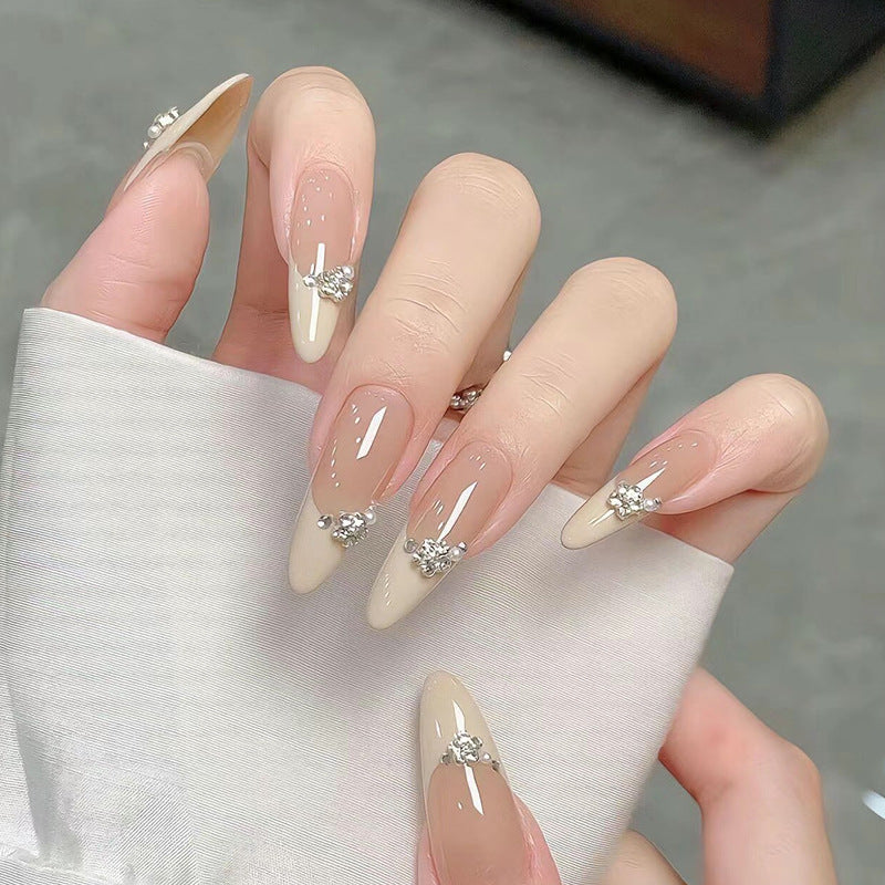 Acrylic nail set with elegant tips and sparkling appliqués Acalora