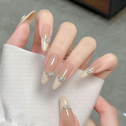 Acrylic nail set with elegant tips and sparkling appliqués Acalora