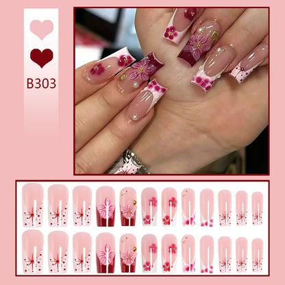 Artificial nail set with floral detail and glitter effects Acalora