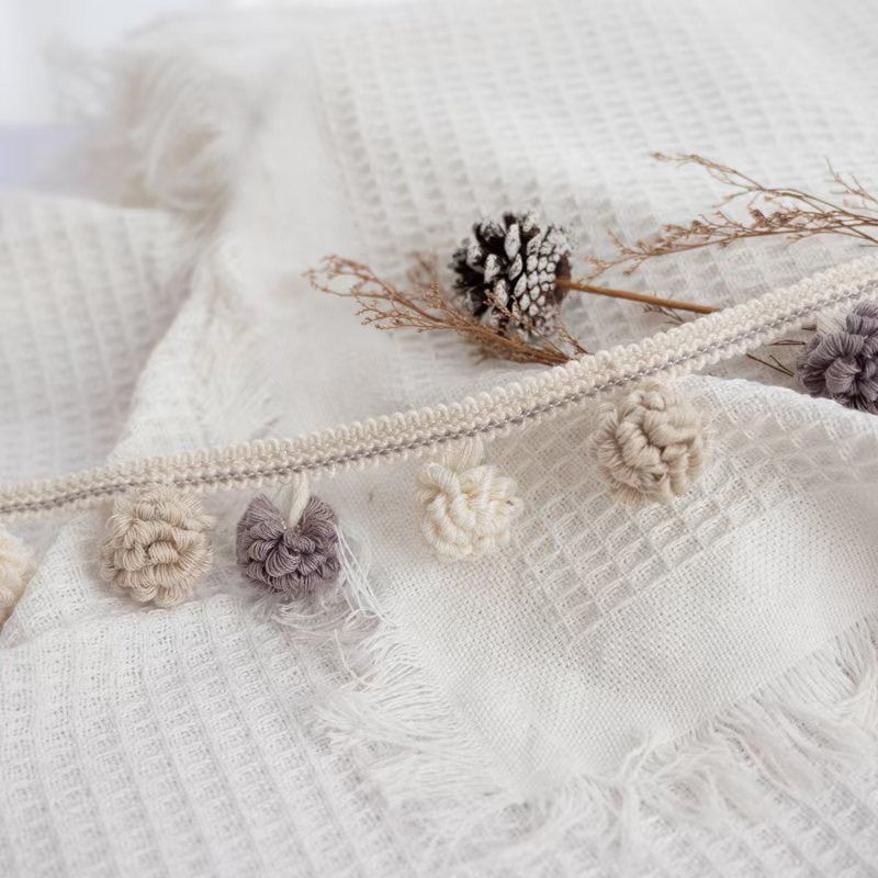 Decorative border with pompons Acalora