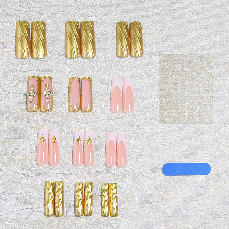 Acrylic nail set with elegant golden embellishments and glamorous accents Acalora