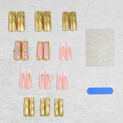 Acrylic nail set with elegant golden embellishments and glamorous accents Acalora