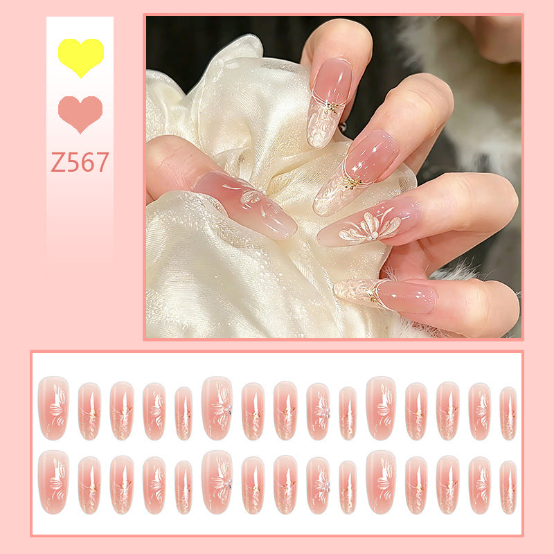 Acrylic nail set with filigree flower and glitter elements Acalora