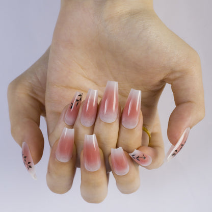 Press-on nails in elegant ombre design with floral accents Acalora
