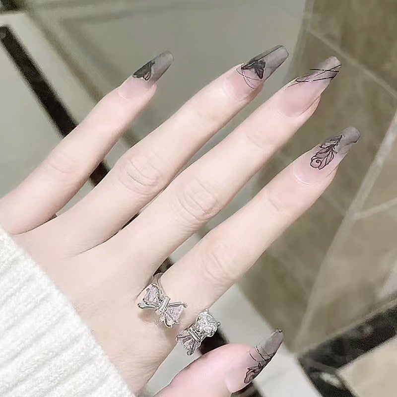 Artificial nail set with elegant flower design and delicate butterfly motifs Acalora