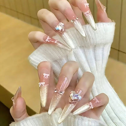Art nail set with sparkling tips and delicate bow decorations Acalora